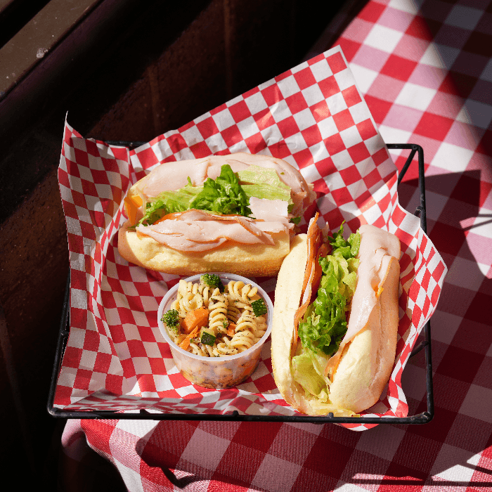 Mollica’s Italian Market and Deli signature dishes The Godfather SubSausage CannoliMeatball Sub